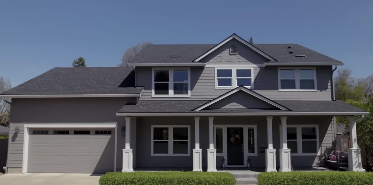 Two-story Will County home with a freshly painted gray exterior and crisp white trim